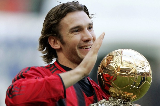 AC Milan Ukranian striker Andriy Shevchenko smiles as he holds the Golden Ball trophy he was recently awarded prior to the start of the Italian first division soccer match between AC Milan and Lecce at the San Siro stadium, in Milan, Italy, Thursday, Jan. 6, 2005. (AP Photo/Luca Bruno)