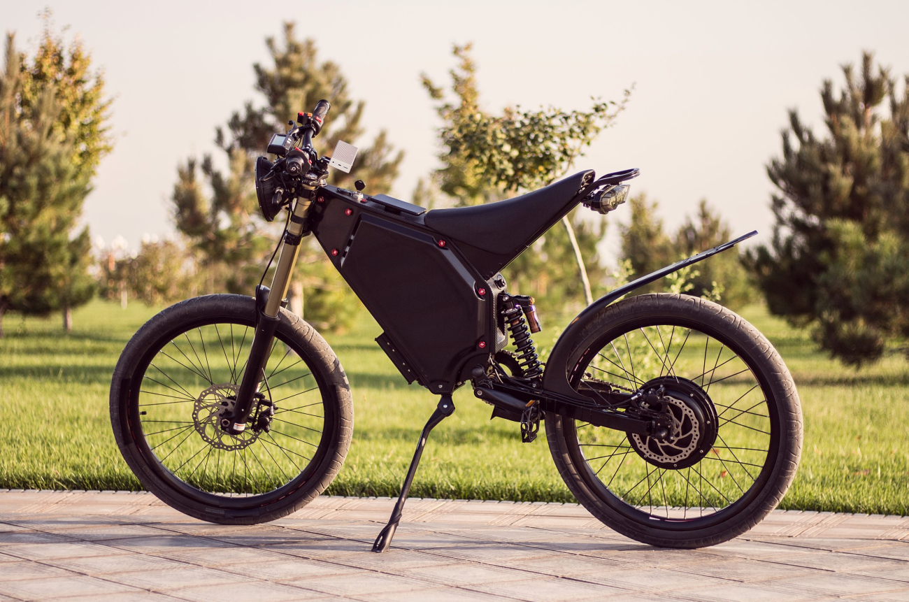 Electric bike battery motor wheel with pedal and rear shock absorber. Ebike bicycle environmentally friendly eco e-mountainbike transport. Healthy lifestyle