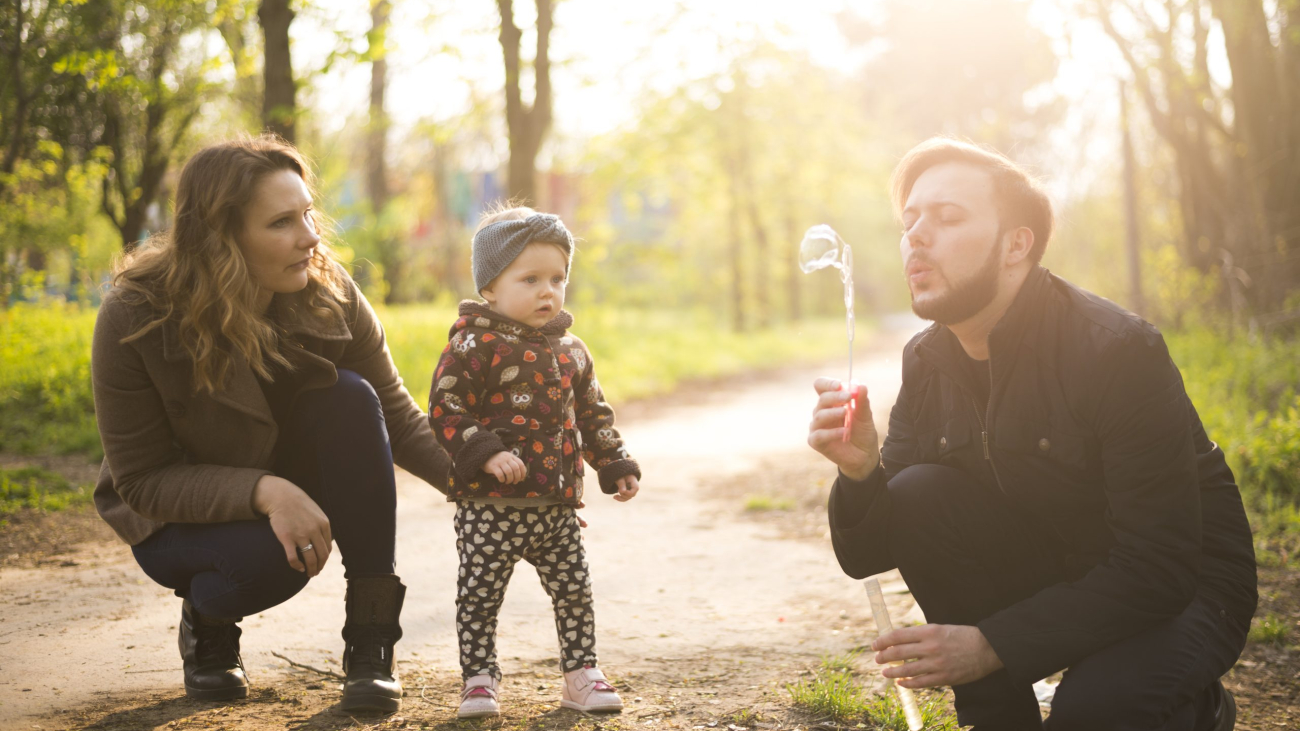 happy-parents-with-child-nature