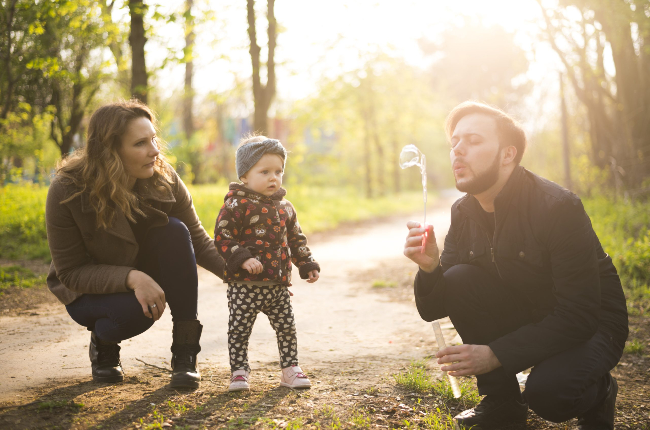 happy-parents-with-child-nature