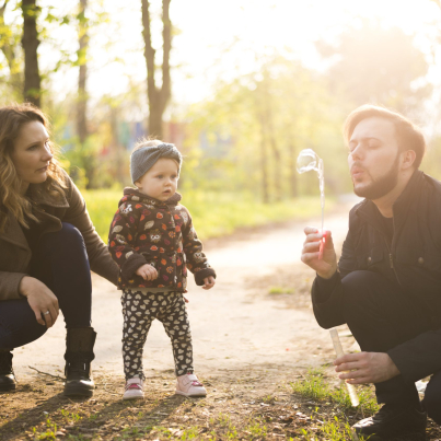 happy-parents-with-child-nature