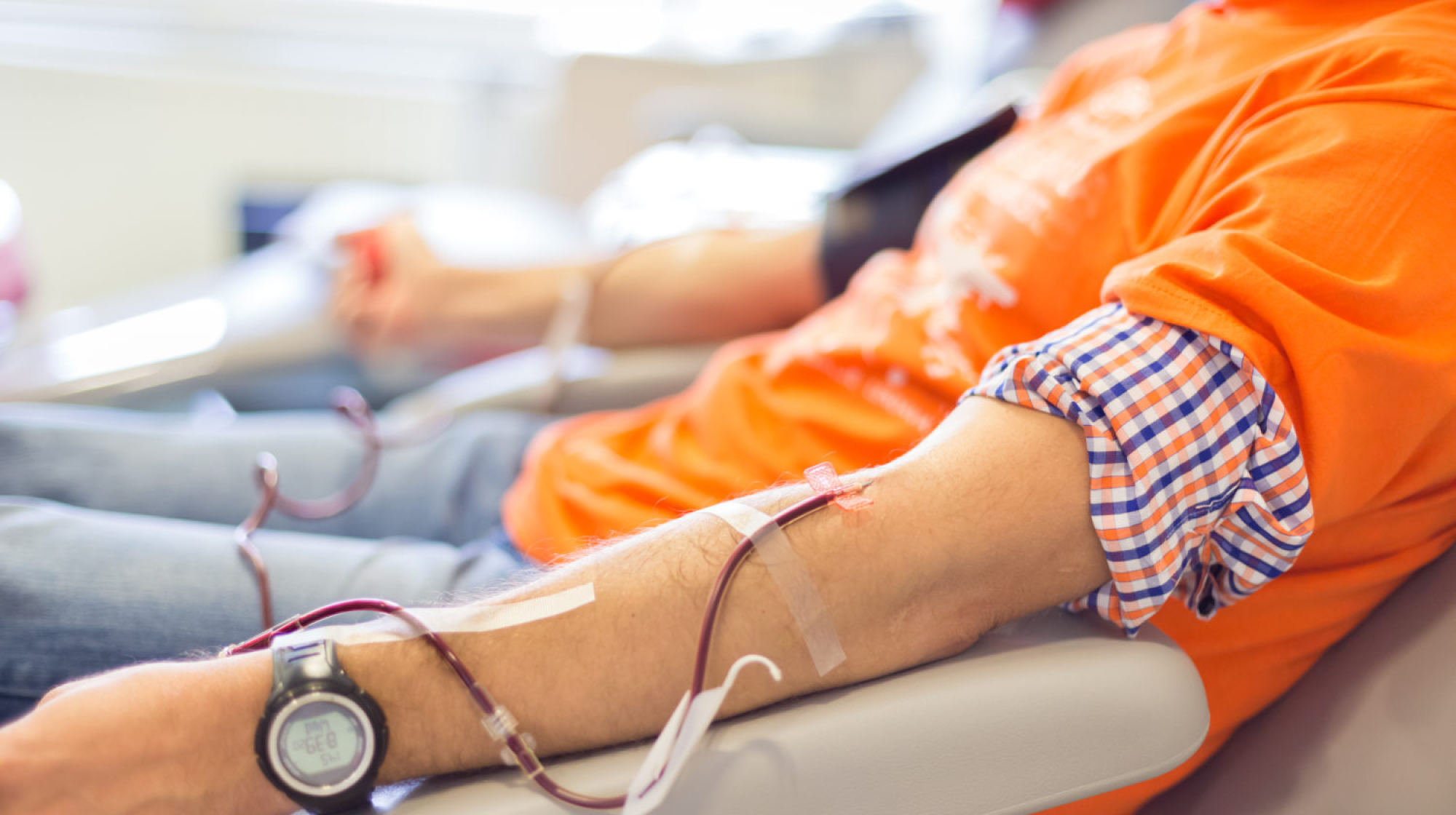 Blood donor at donation with a bouncy ball holding in hand.