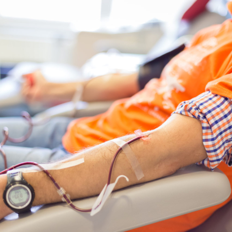 Blood donor at donation with a bouncy ball holding in hand.